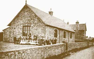 Mr. Preece and his pupils outside the school